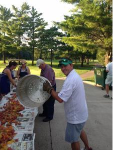 Kenny serving some boiled shrimp at Argo’s annual Winnebago shrimp boil in Iowa.